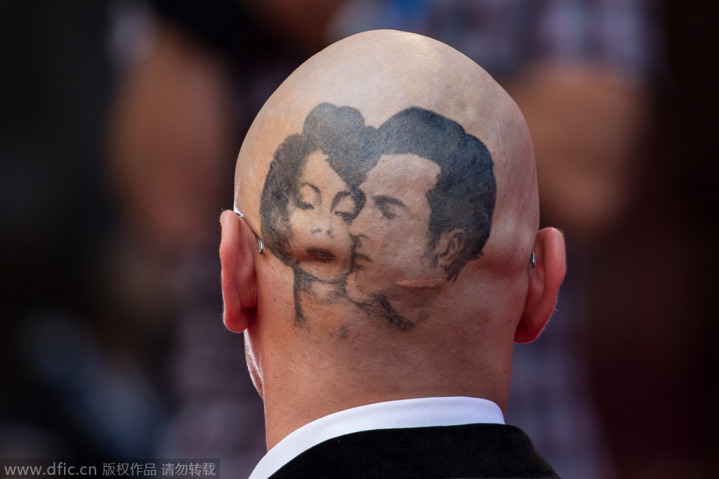 当地时间2014年9月5日，意大利威尼斯，第71届威尼斯电影节《喧哗与骚动》首映礼。詹姆斯-弗兰科光头造型展示纹身
