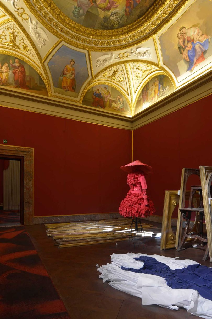 in military  gabardine, silk chiffon, and feathers, by john